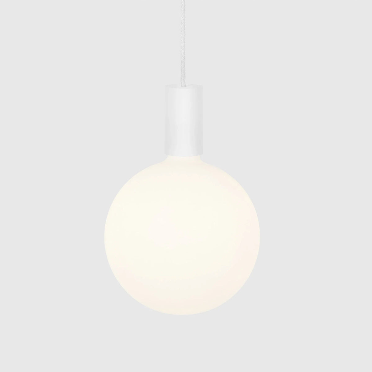 Cylinder pendant with matt white globe bulb, chalk, bulb at a warm dimmed setting, alternative view