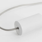 Cylinder pendant with matt white globe bulb, chalk, close-up of the holder, on a plain background