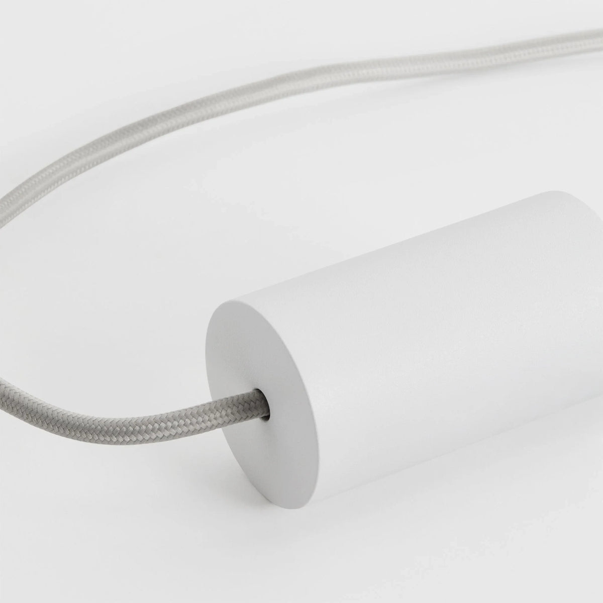 Cylinder pendant with matt white globe bulb, chalk, close-up of the holder, on a plain background