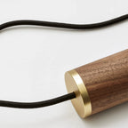 Dim-to-warm globe pendant, walnut, close-up of the walnut holder