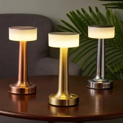 Glowing disc cordless table lamp, in rose gold, gold and silver, lit