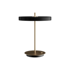 Disc-top LED table lamp with brass stem, in black