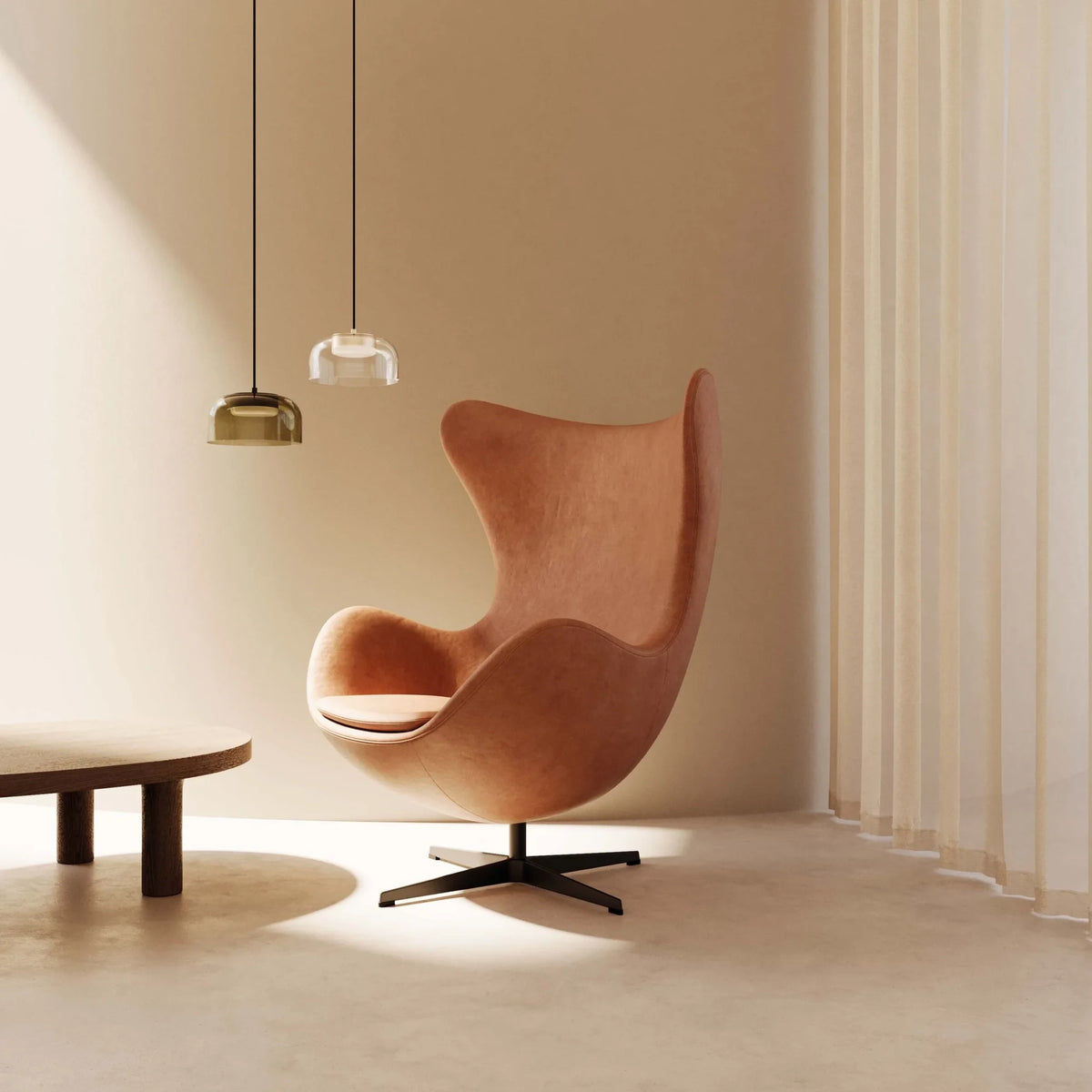 Domed glass pendant with integrated LED, beside an armchair