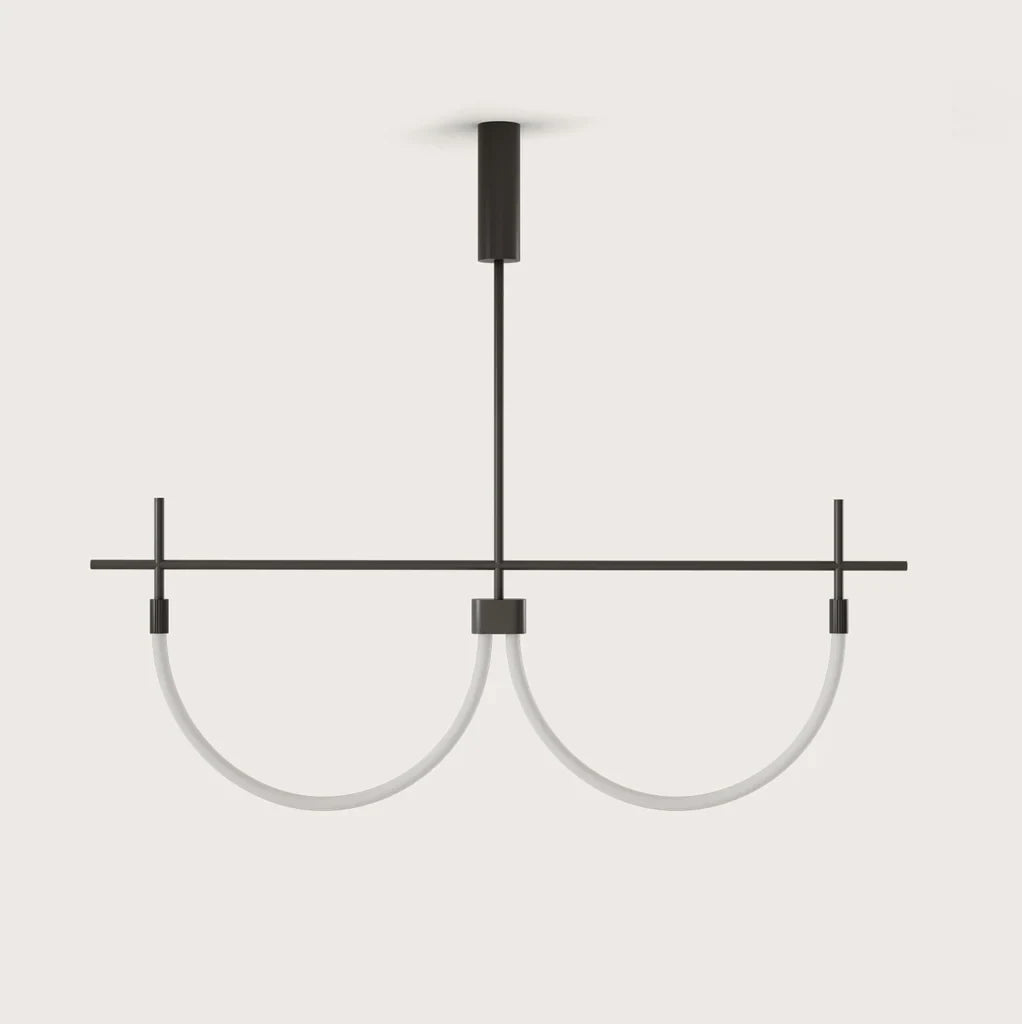 Double curved opal tube linear LED pendant, on a plain background