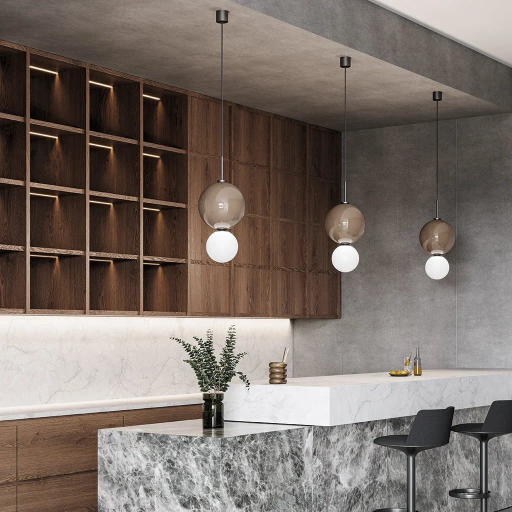 Double glass sphere pendant, row above a bar counter