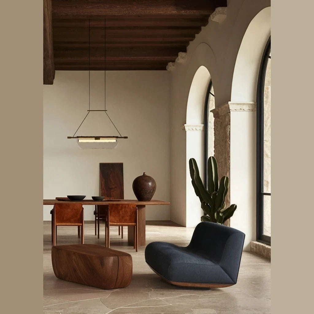 Draped glass linear LED pendant, single version above a table