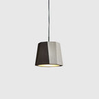 Faceted concrete pendant, on a pale background