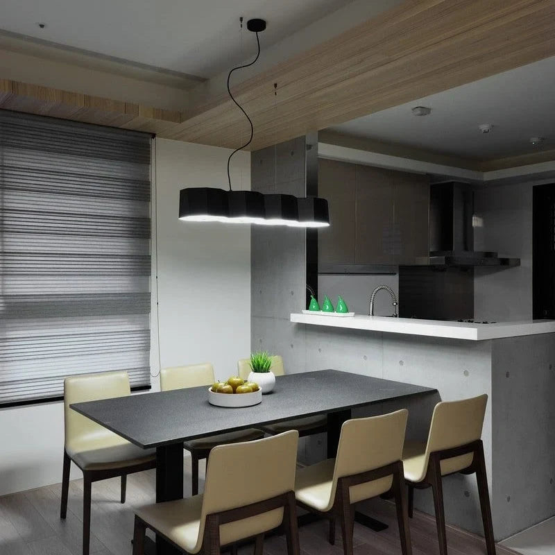 Faceted metal linear pendant, above a dining table