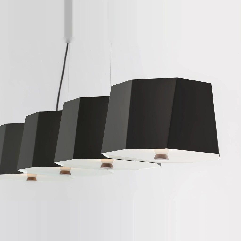 Faceted metal linear pendant, close-up of the black faceted shades