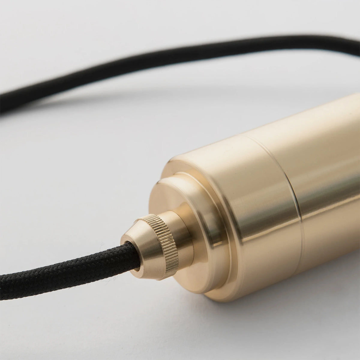 Five-drop cluster pendant, brass, close-up of the brass holder and cable