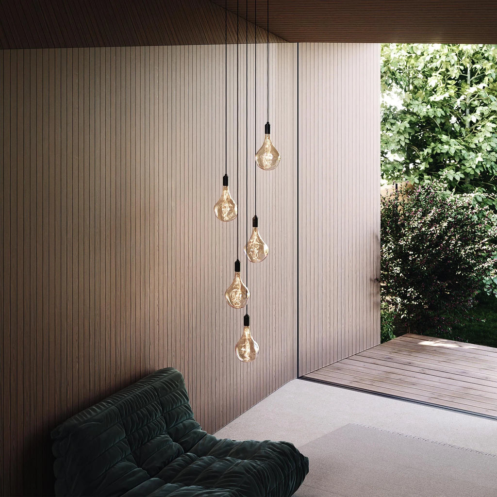 Five-drop cluster pendant, graphite, with decorative bulbs (not included) by a garden window