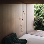 Five-drop cluster pendant, graphite, with decorative bulbs (not included) by a garden window