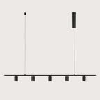 Five-light marble spot linear pendant, in matte black on a plain background