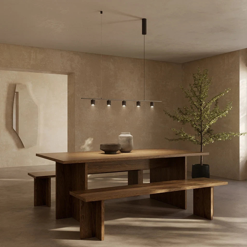 Five-light marble spot linear pendant, above a long wooden dining table