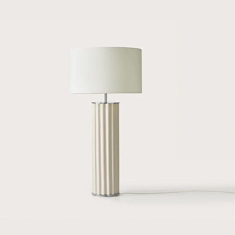 Fluted ceramic column table lamp, in cream, with a white drum shade (not included)