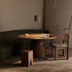 Fluted ceramic LED pendant, above a round dining table