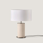 Fluted ceramic table lamp, in cream, with a white drum shade (not included)