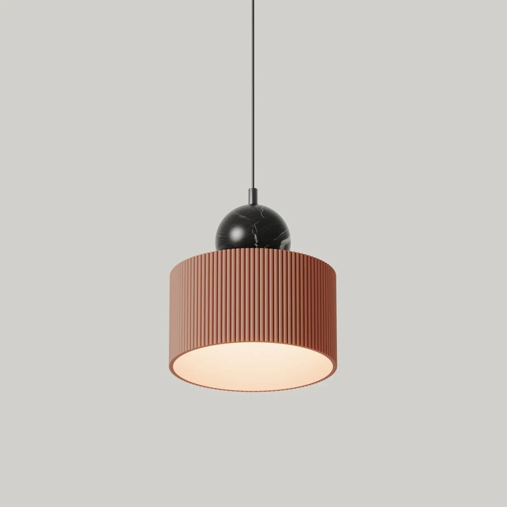 Fluted drum LED pendant with marble sphere, in terracotta with black marble, side view