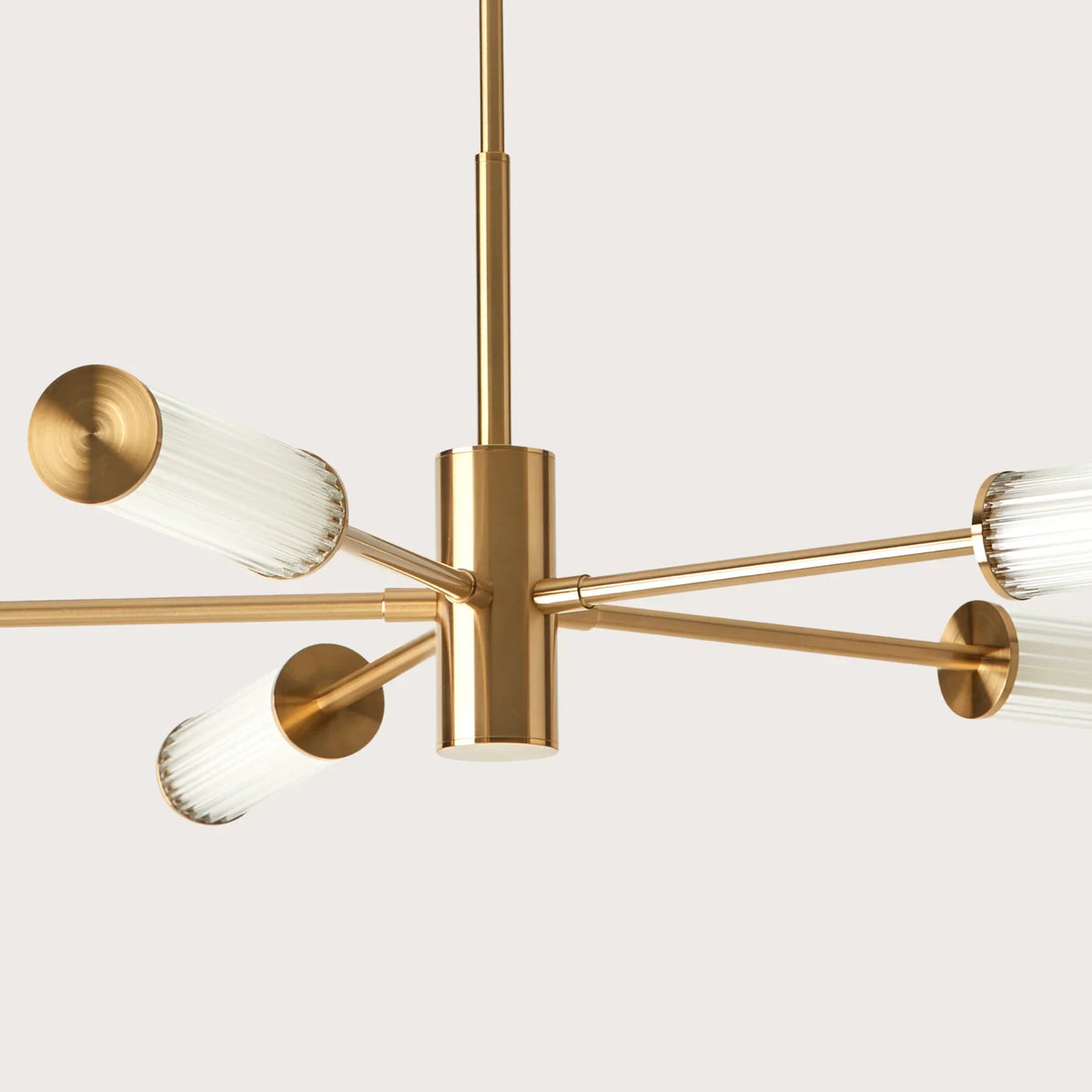 Fluted glass tube LED chandelier, in aged gold, close-up