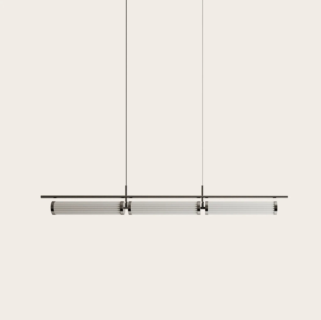 Fluted glass tube linear LED pendant, on a plain background