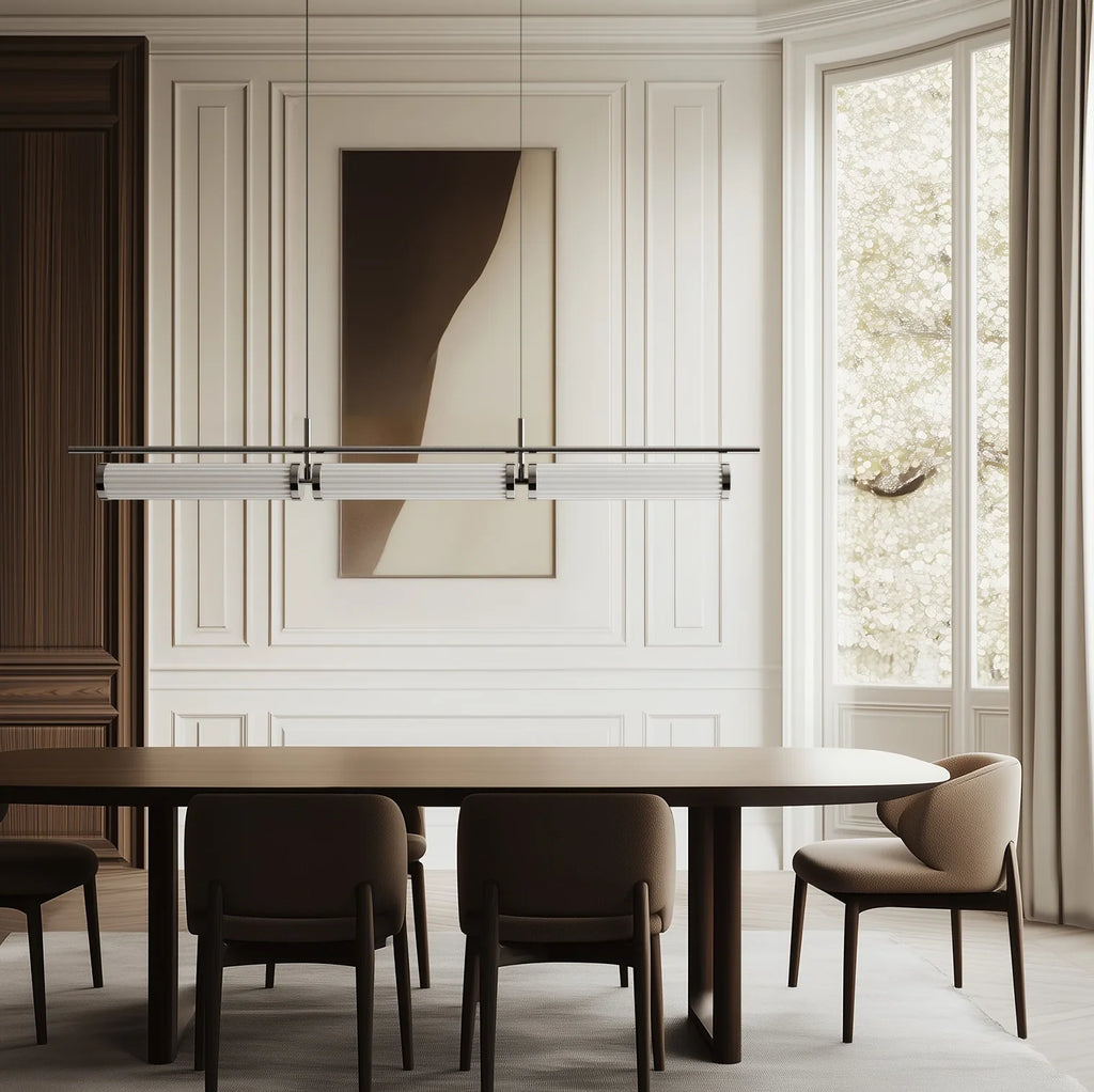 Fluted glass tube linear LED pendant, above a dining table in a panelled room