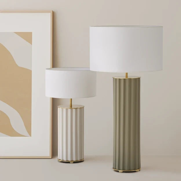 Fluted round ceramic column table lamp, in cream and in sage green, side by side