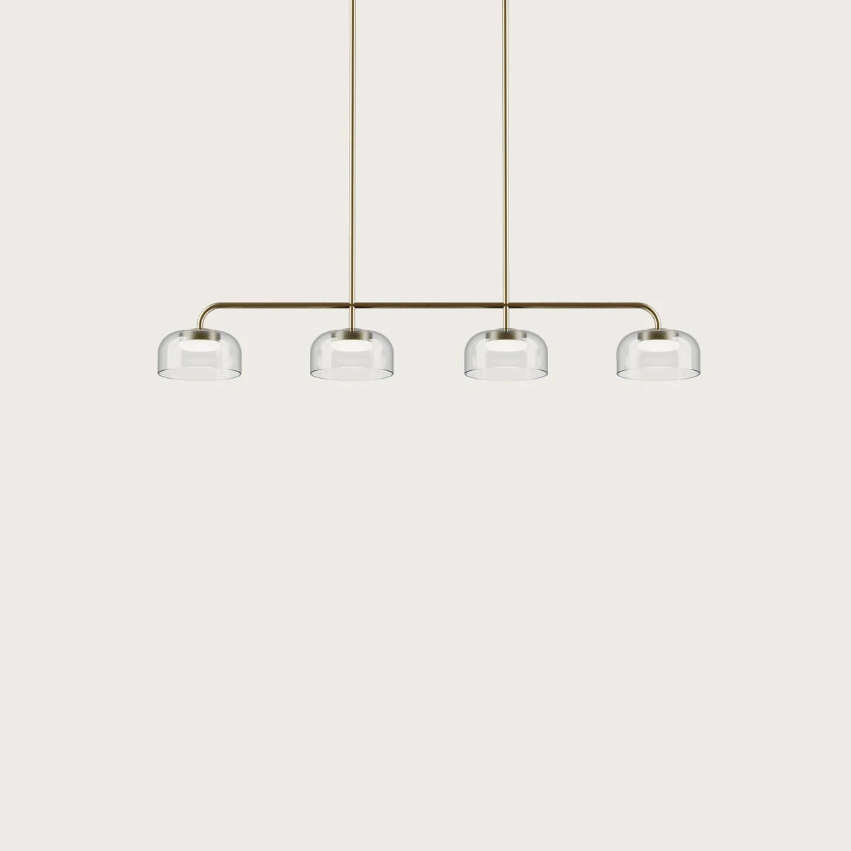 Four-dome linear glass pendant with integrated LED, gold bar with four clear shades on a plain background