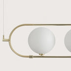 Four globe linear pendant, close-up of glass globe and frame