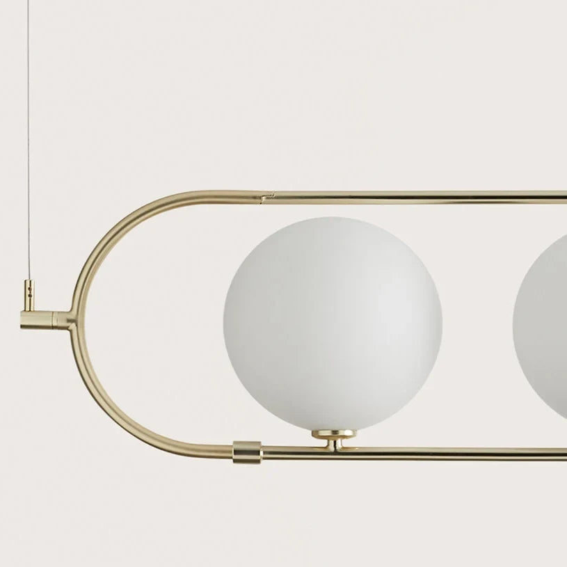 Four globe linear pendant, close-up of glass globe and frame