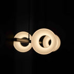 Four-head hollow cone linear LED pendant, lit heads, close-up