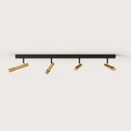 Four-spot ceiling bar light, with gold spots on a black bar