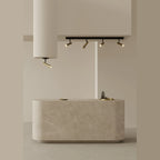 Four-spot ceiling bar light, above a stone-topped island