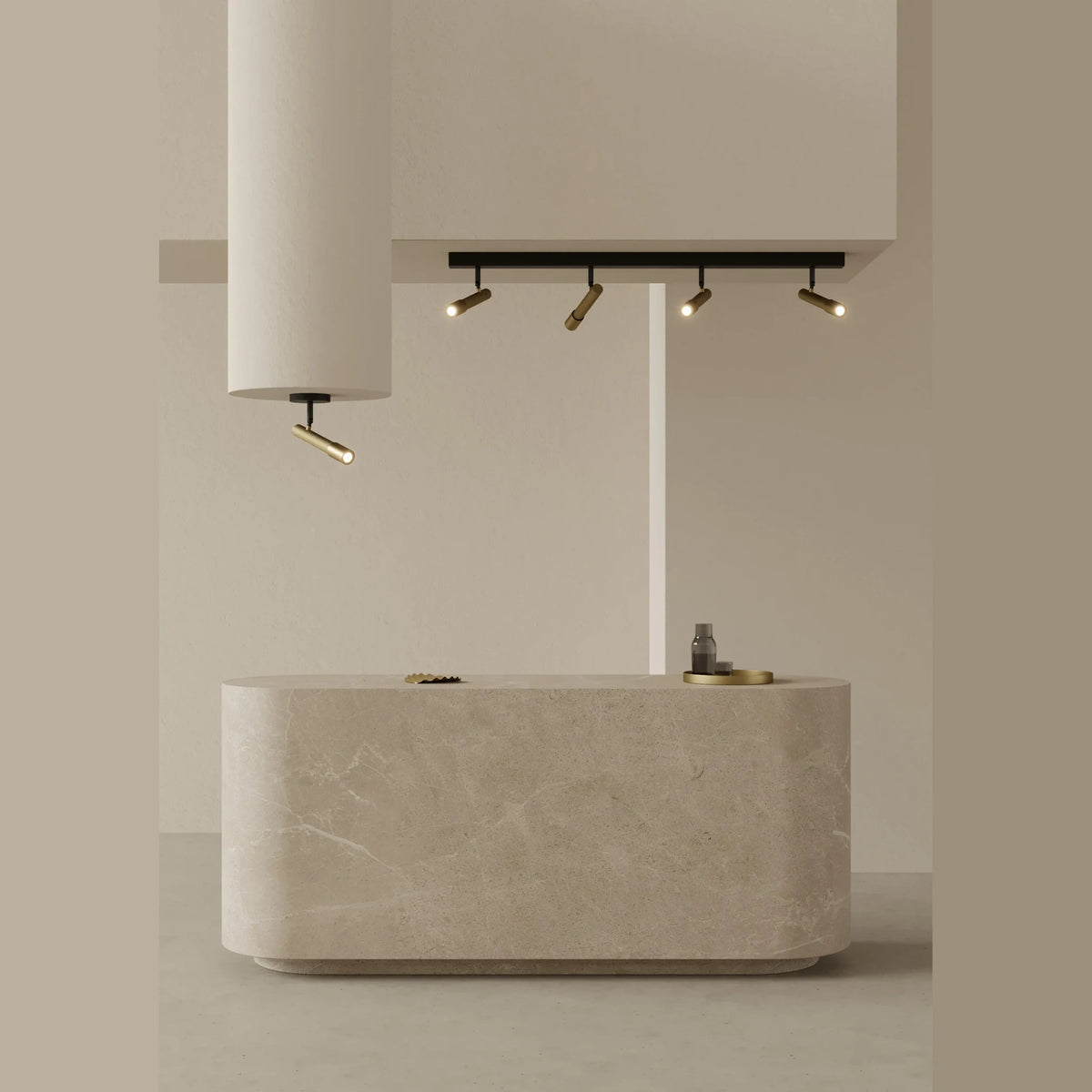 Four-spot ceiling bar light, above a stone-topped island