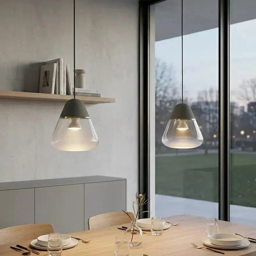 Frosted glass cone pendant, above a dining table