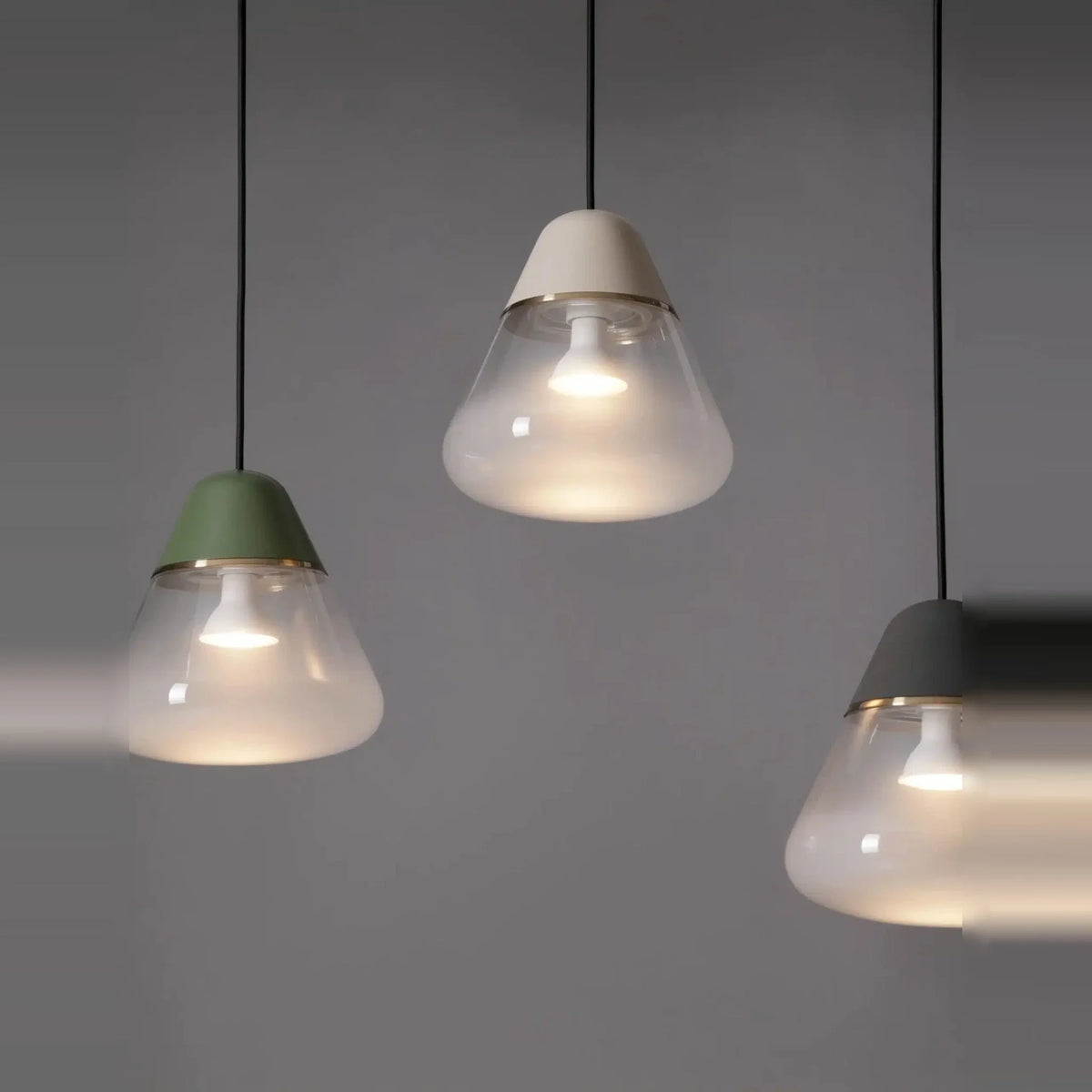 Frosted glass cone pendant, three together, lit