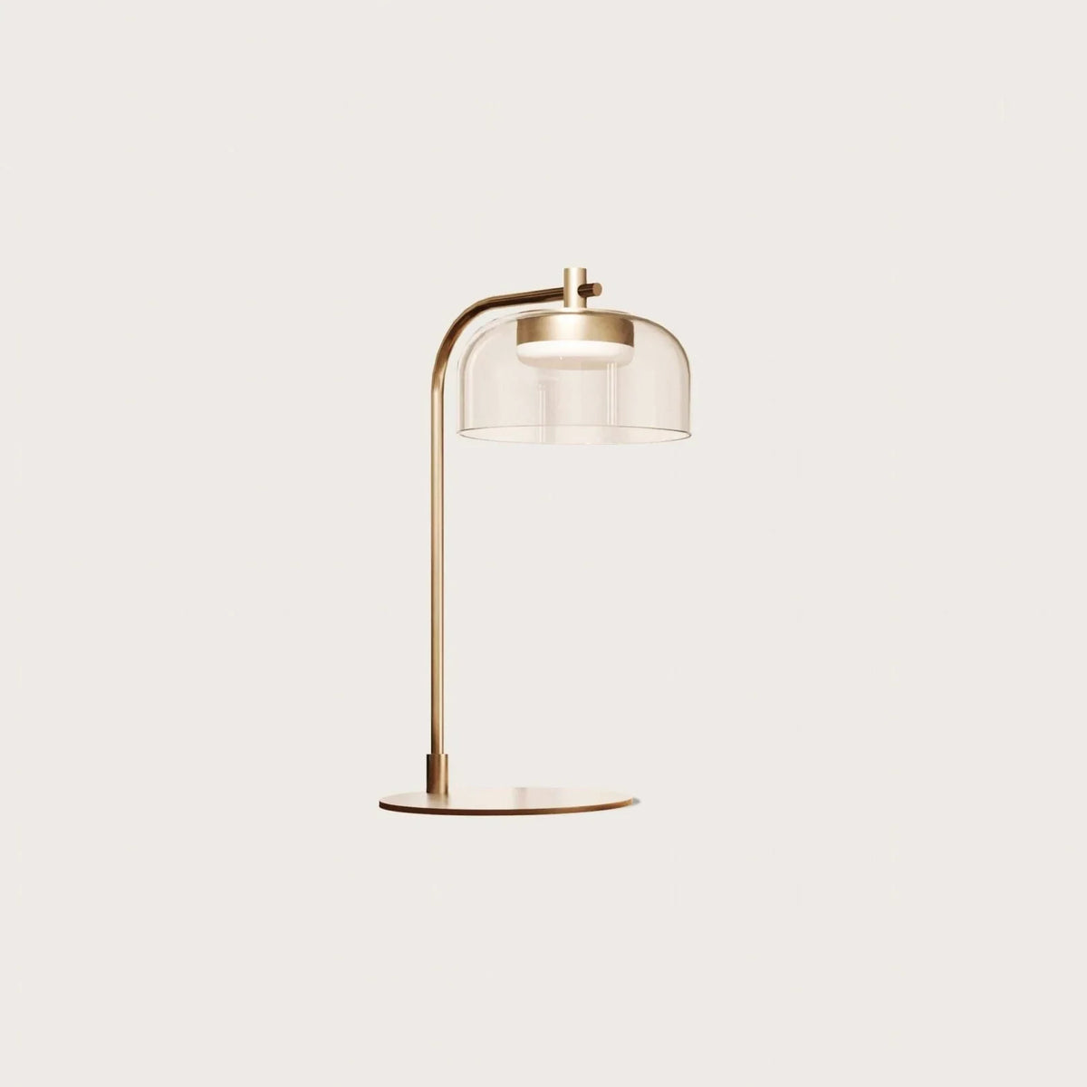 Arc table lamp with glass dome shade, in aged gold with a clear glass shade