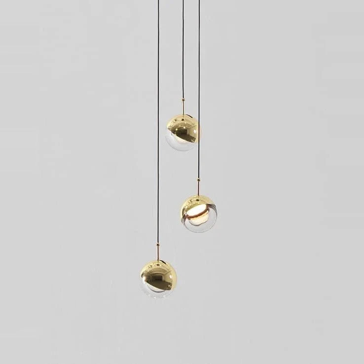 Glass globe cluster pendant, three lights, in brass