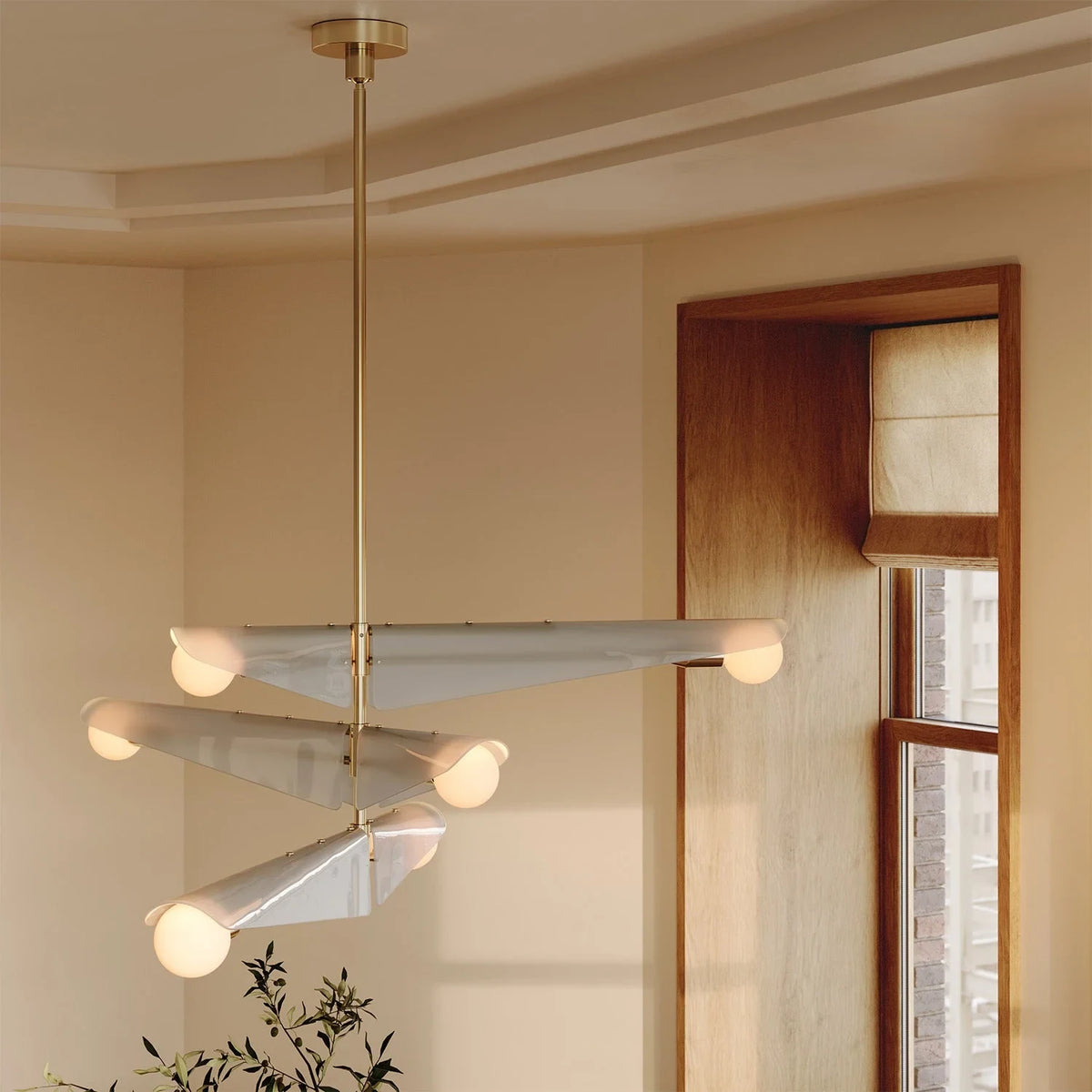 Glass wing chandelier, in a hallway by a window