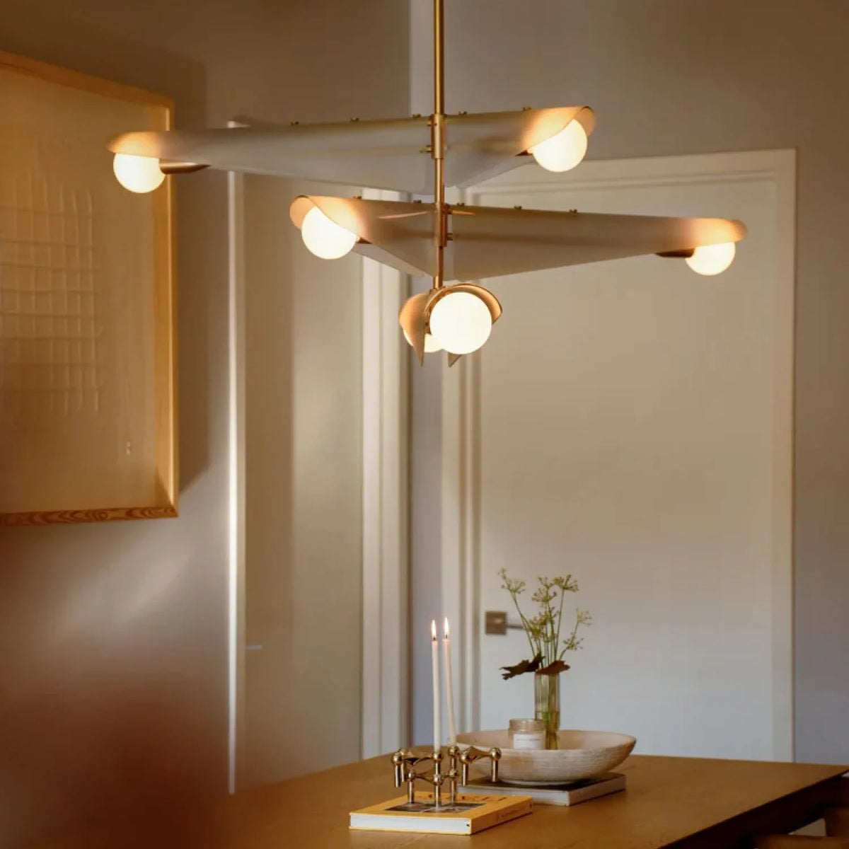 Glass wing chandelier, above a dining table