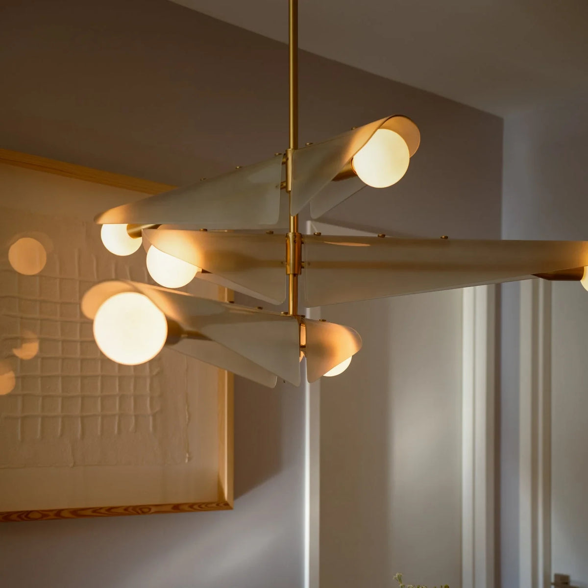 Glass wing chandelier, in a dining room
