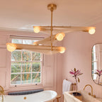 Glass wing chandelier, in a pink bathroom