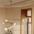 Glass wing chandelier, in a hallway by a window