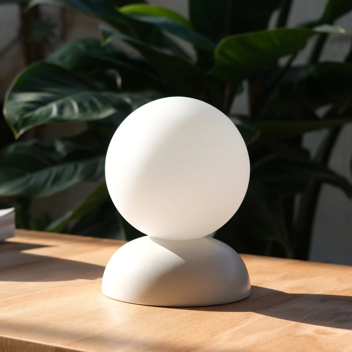Glazed stoneware globe table lamp, in matte white