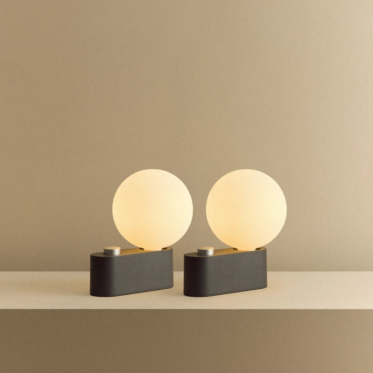Globe table lamp or wall light, charcoal, set of 2, pair on a shelf