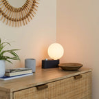 Globe table lamp or wall light, charcoal, set of 2, on a chest of drawers