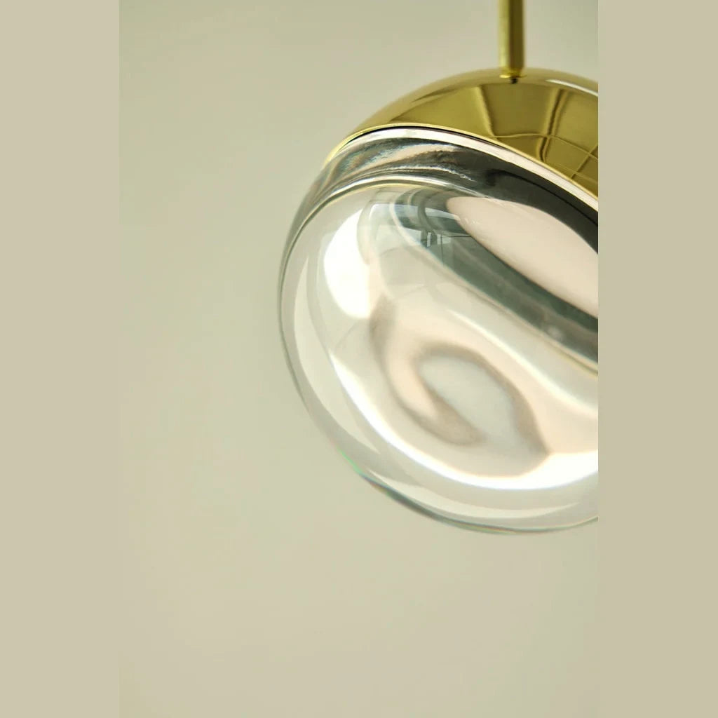 Gold and optic glass sphere LED pendant, close-up of the optic glass