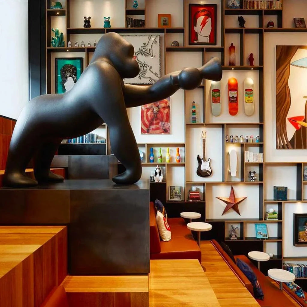 Gorilla floor lamp with an adjustable arm