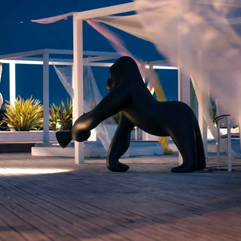 Gorilla floor lamp with an adjustable arm