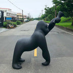 Gorilla floor lamp with an adjustable arm