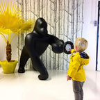 Gorilla floor lamp with an adjustable arm